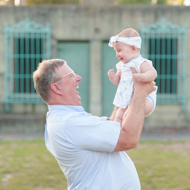 This toddler had a great time looking at all the family being silly for smiles during the pictures.…