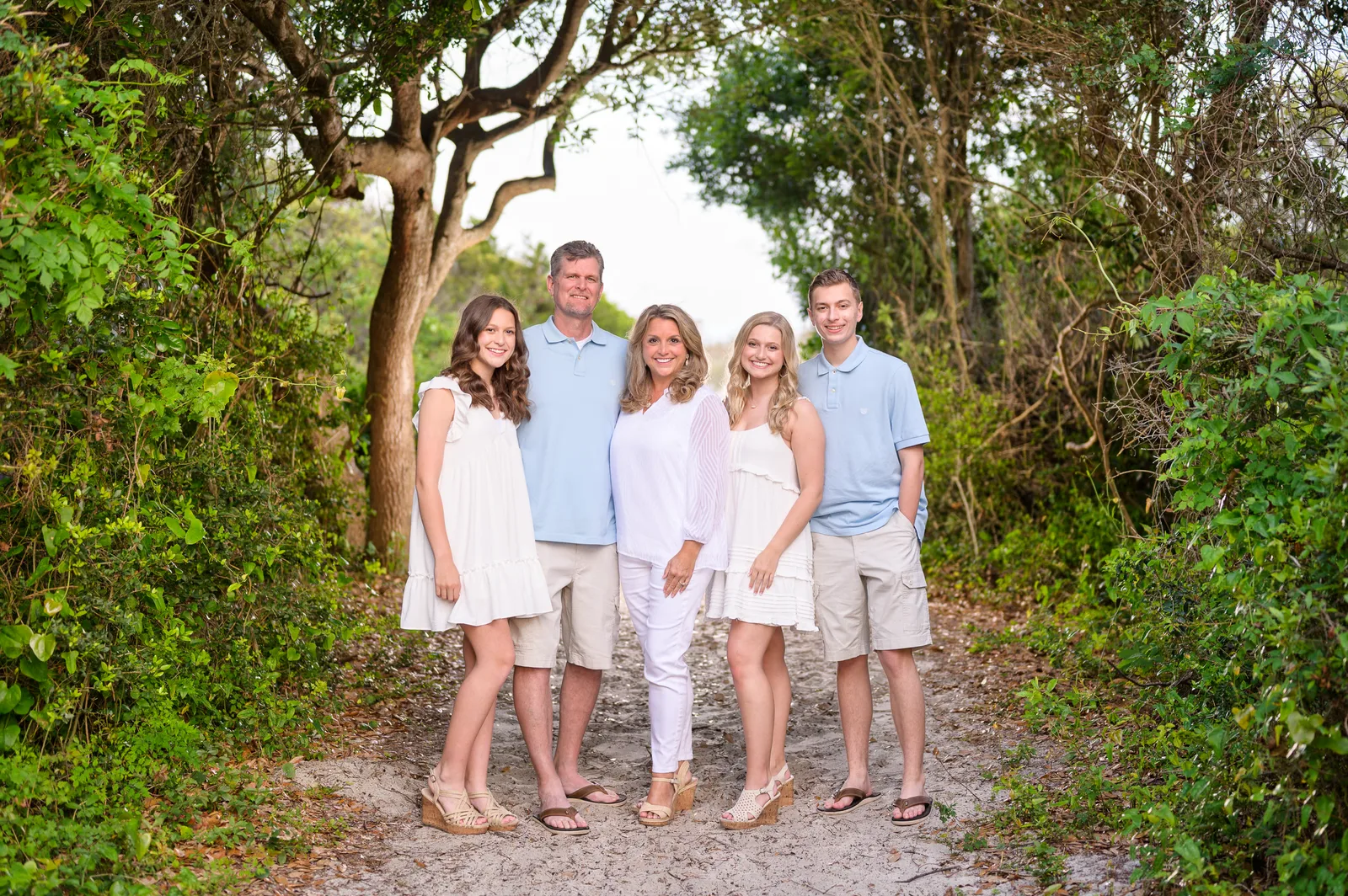 Family on the wooded beach path backlit by a Godox AD300 - Huntington Beach State Park