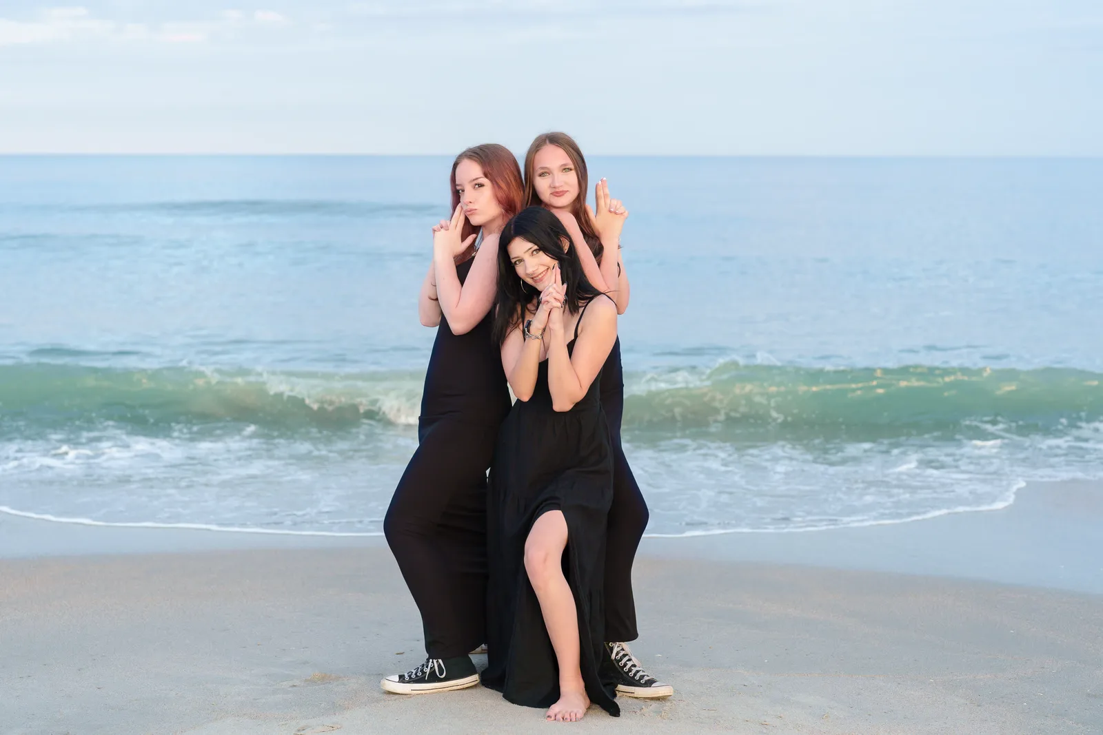 Best friends doing a Charlie's Angles pose by the ocean - Huntington Beach State Park