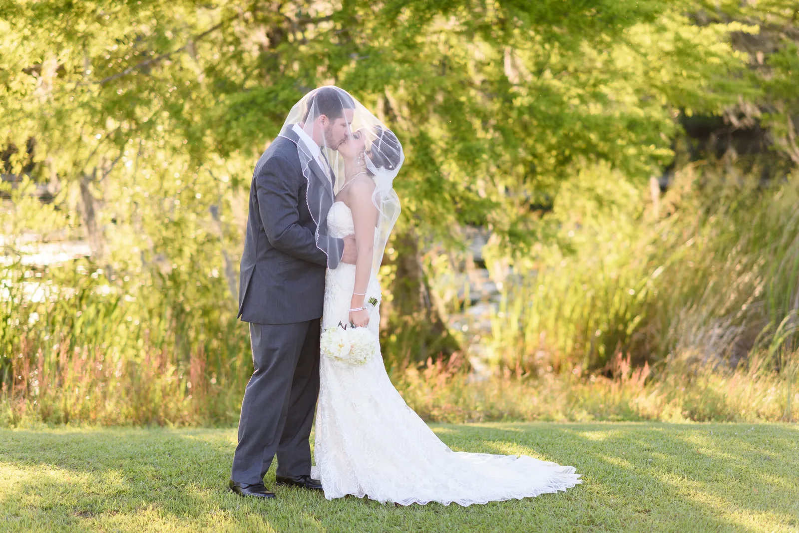 Kiss under the bride's veil - Upper Mill Plantation