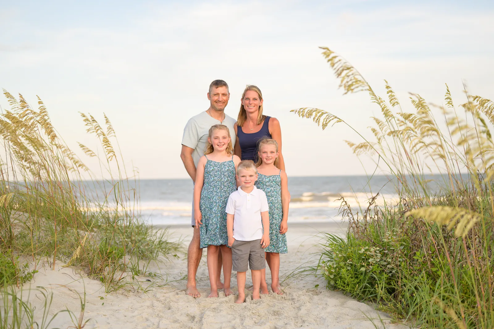 Happy family by he sea oats - Huntington Beach State Park