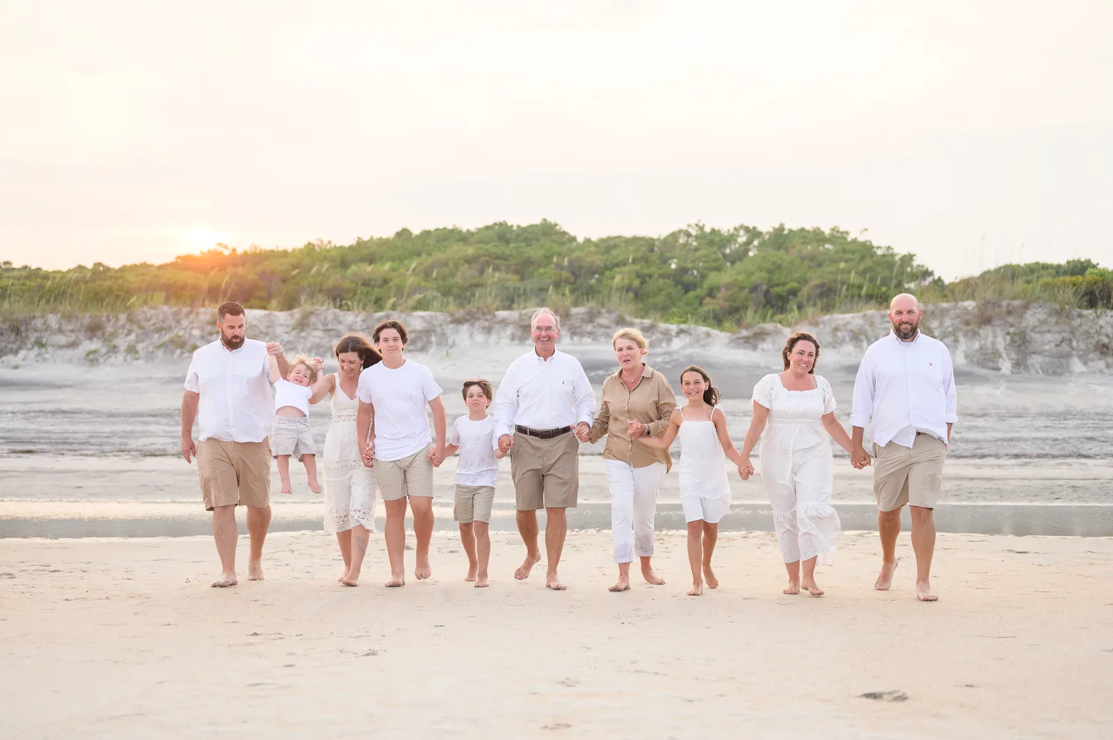 Happy family walking from the sunset - Huntington Beach State Park