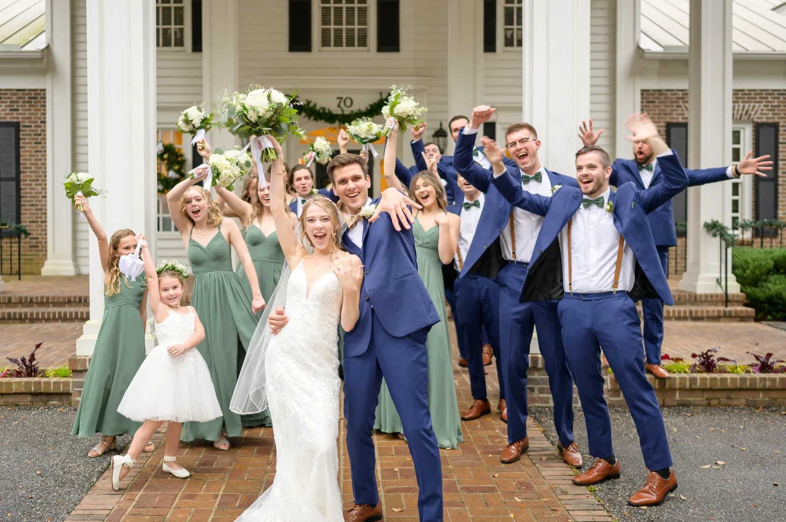 Sowing of the rings with bridal party cheering in the background - Pawleys Plantation Golf & Country Club