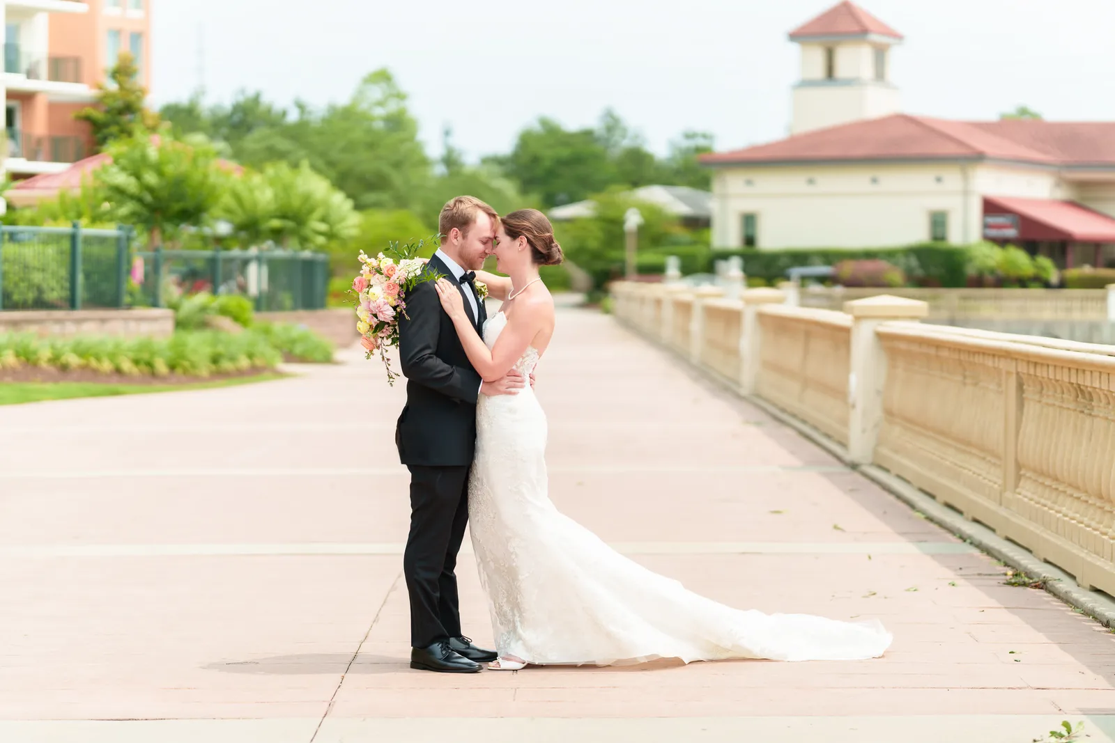Bride and groom on the boardwalk by the docks - Marina Inn at Grande Dunes