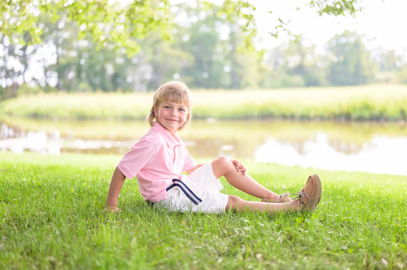 Little boy sitting by the river - Caledonia Golf & Fish Club