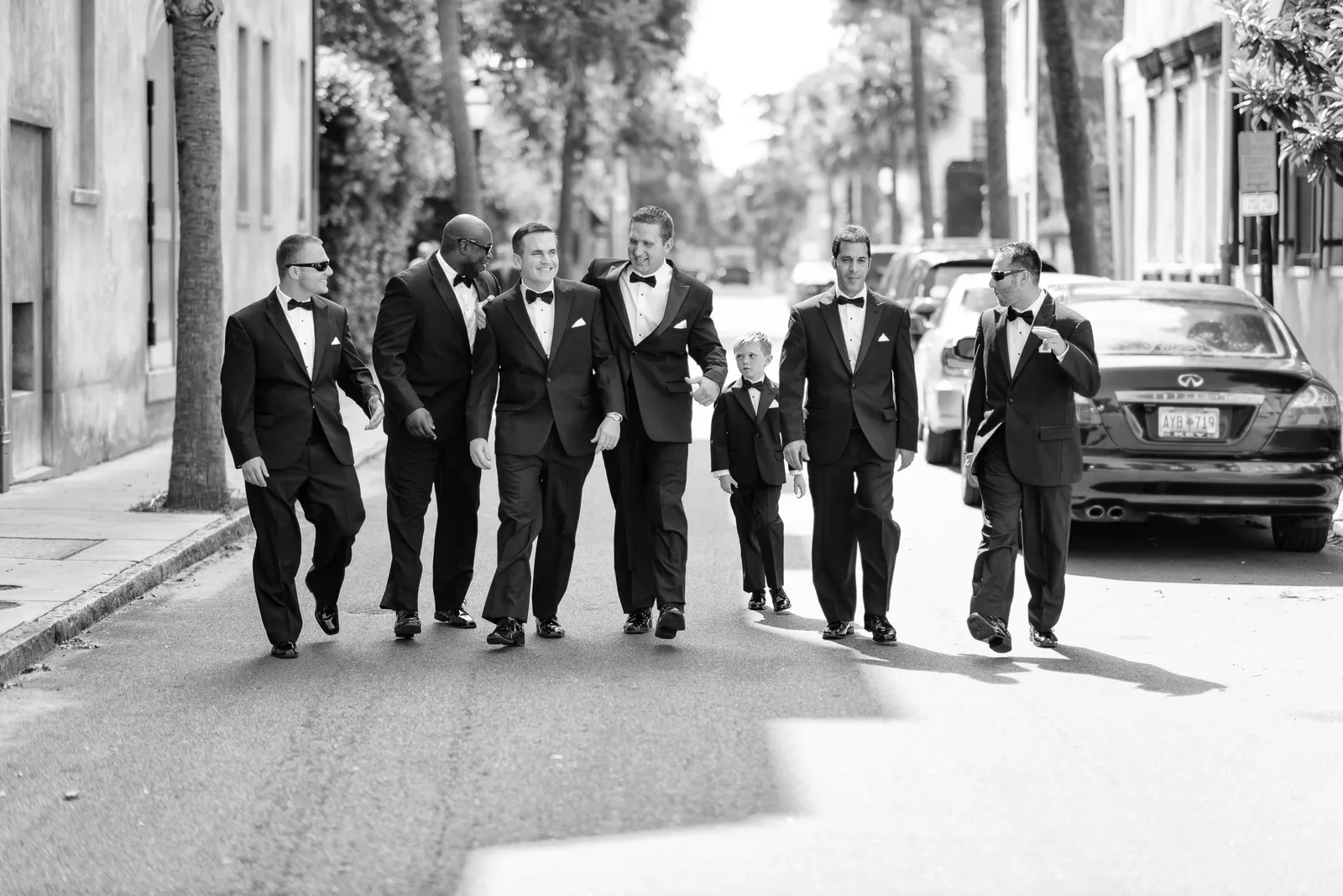 Groomsmen walking down the street together - Downtown Charleston, SC