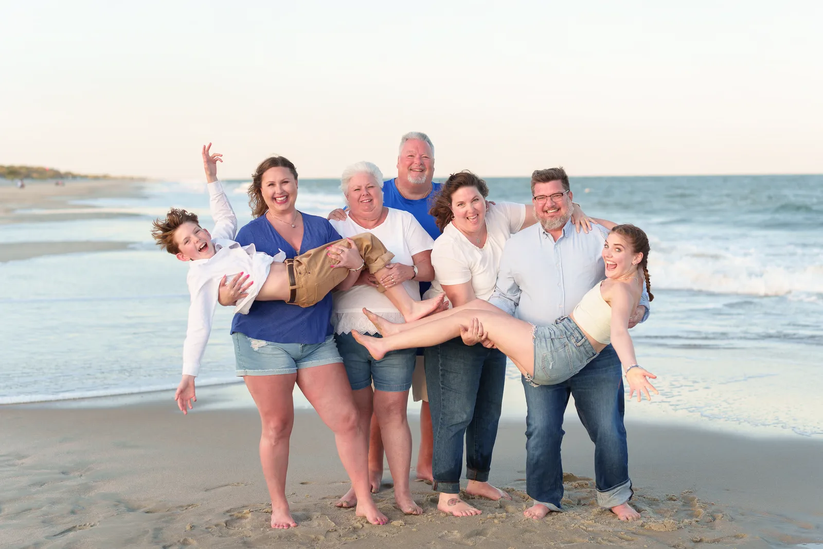 Family with grandparents having fun by the ocean - Huntington Beach State Park