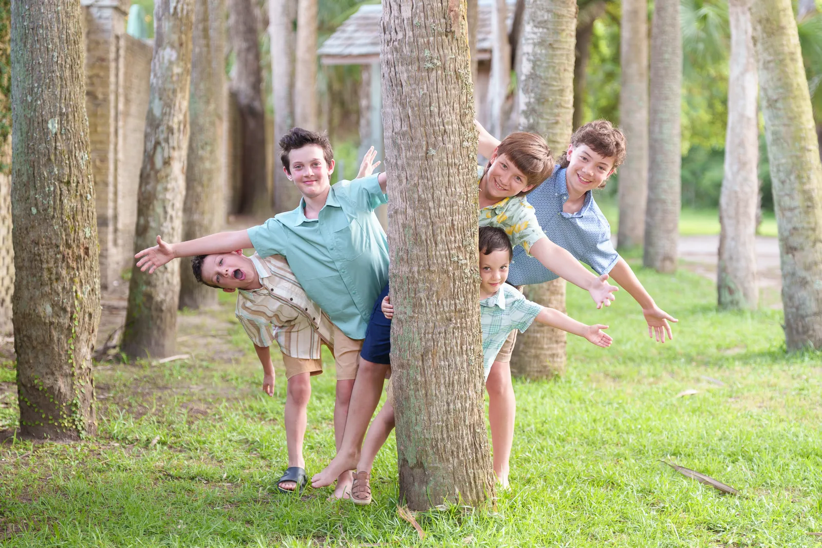 Boys having fun around the palm trees - Huntington Beach State Park