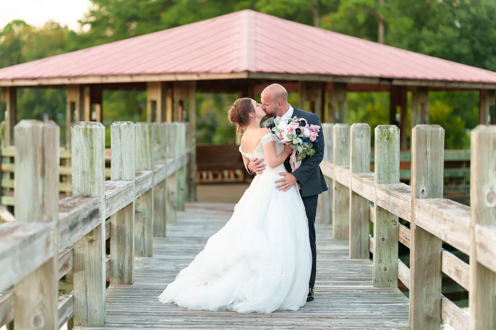 Kiss at the gazebo on the lake - The Pavilion at Pepper Plantation