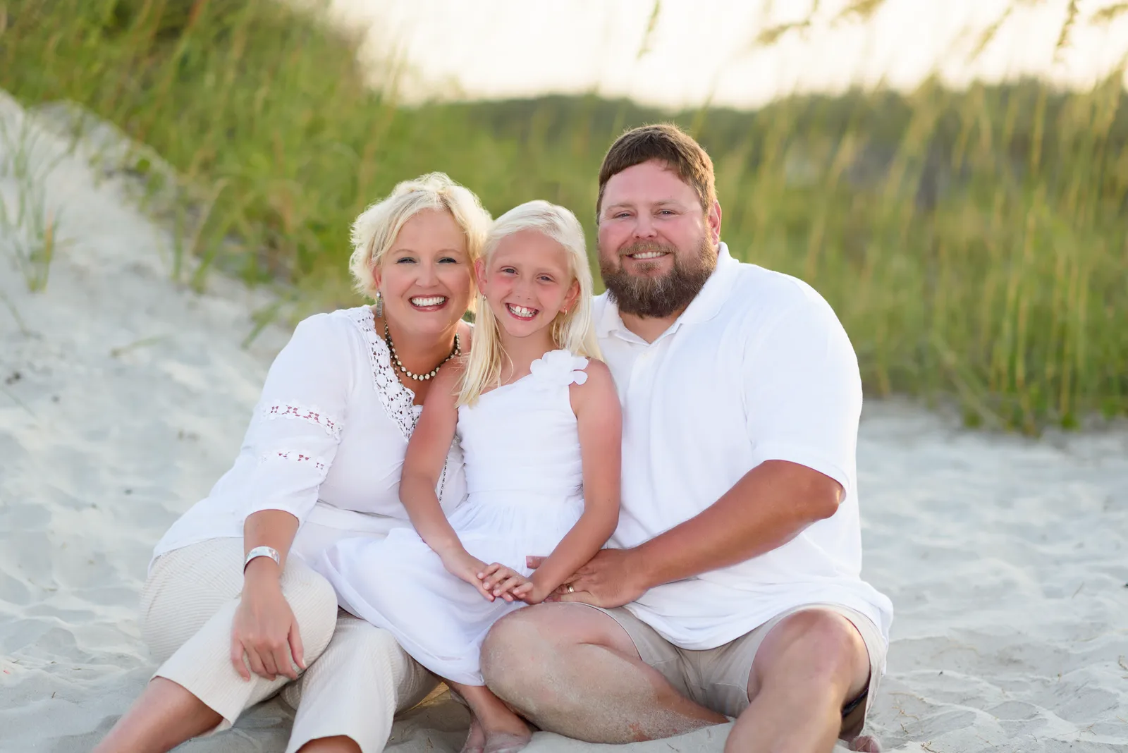 Happy family by the dunes on a windy day, touching up the hair took me a while. - Myrtle Beach State Park