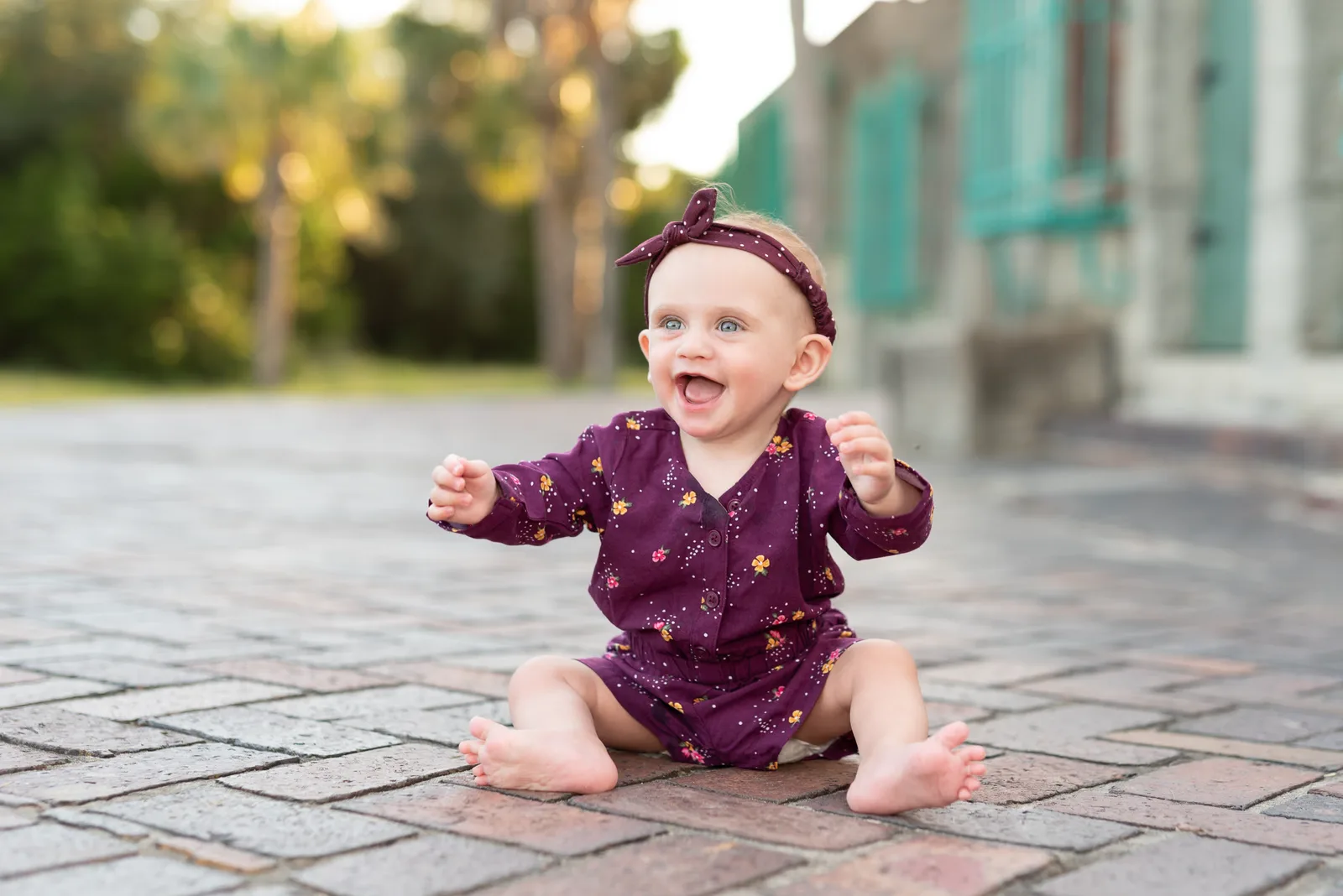 Happy baby laughing at mom and dad - Atalaya Castle