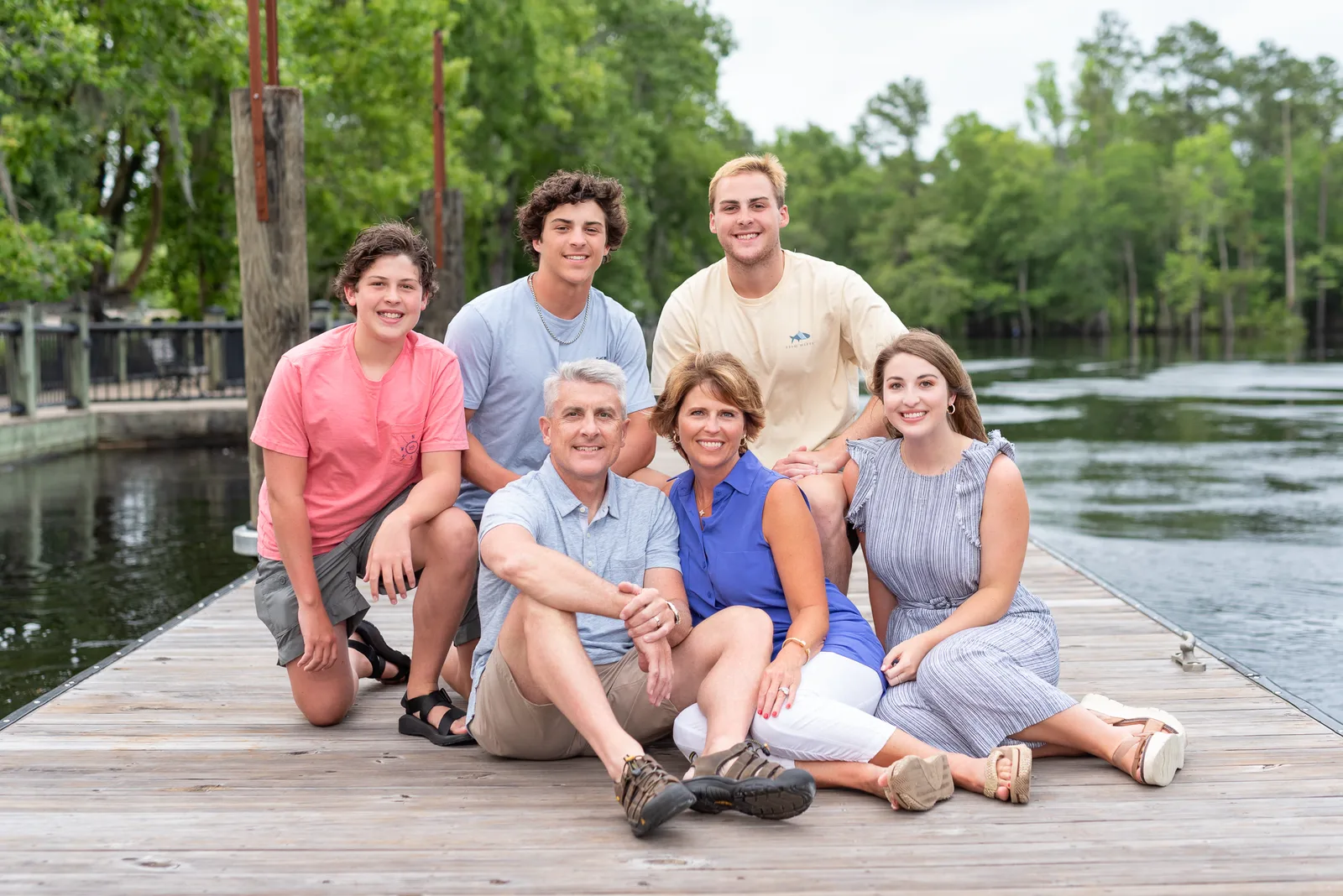 Family of 6 sitting by the river - Conway Riverwalk