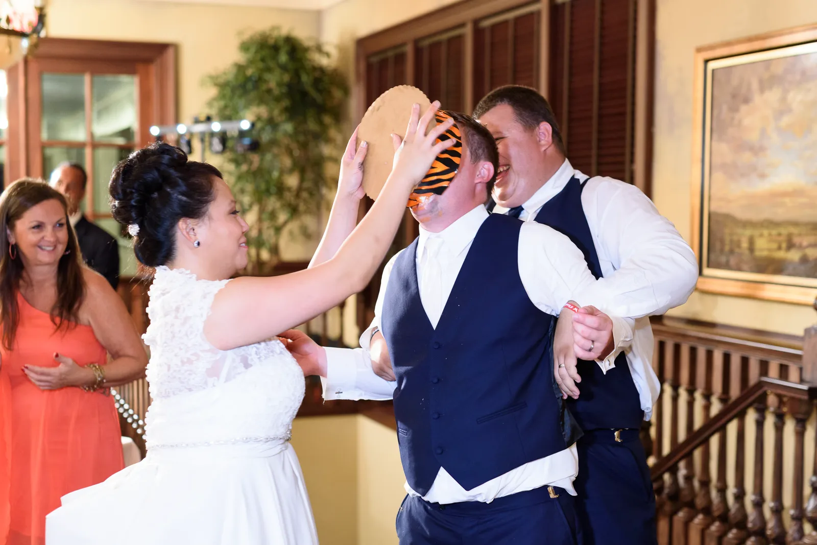 Bride and groom getting wild with the cake smash - Dye Club at Barefoot Resort
