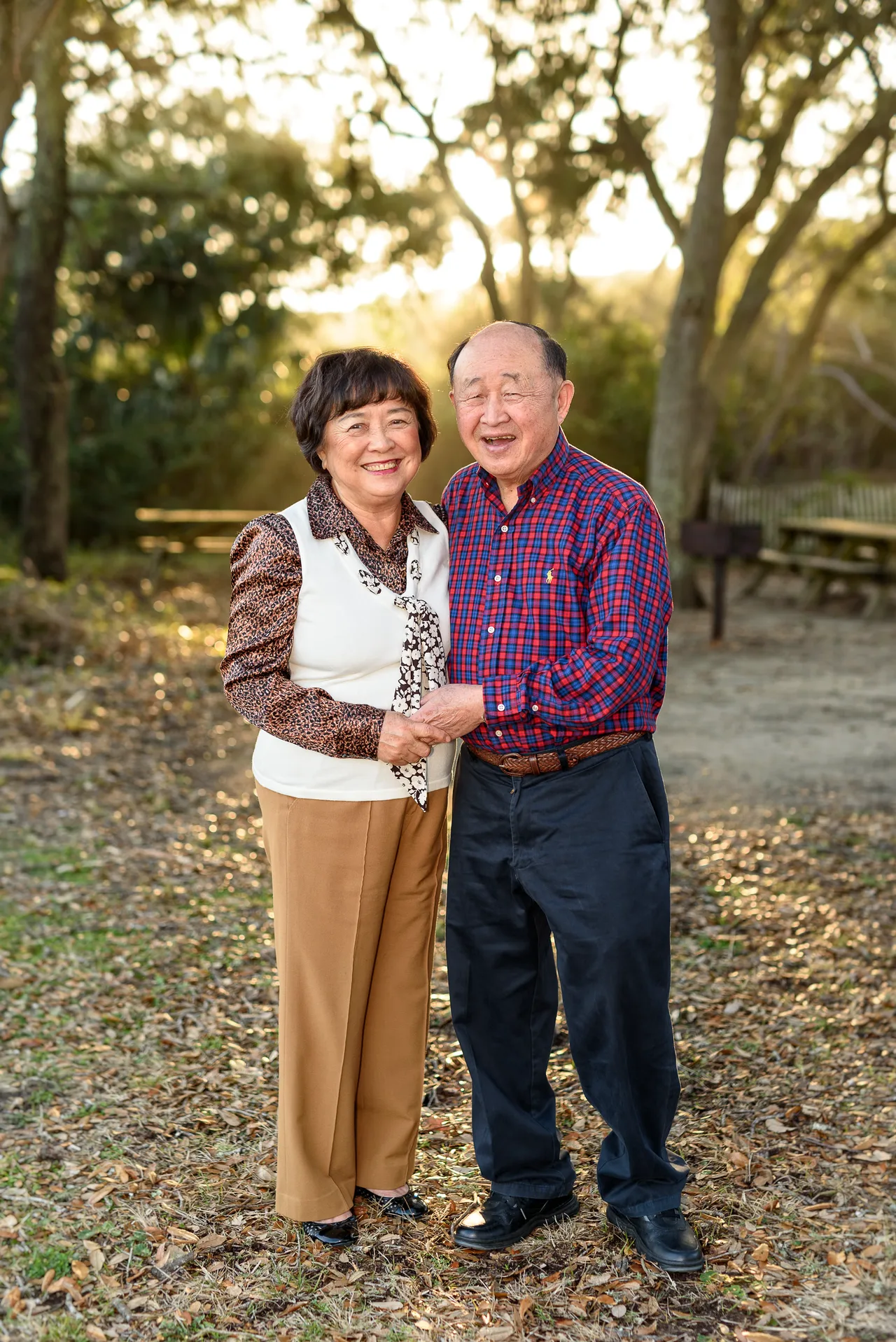 Happy couple holding hands - I love the way the winter sunlight comes through the trees - Myrtle Beach State Park