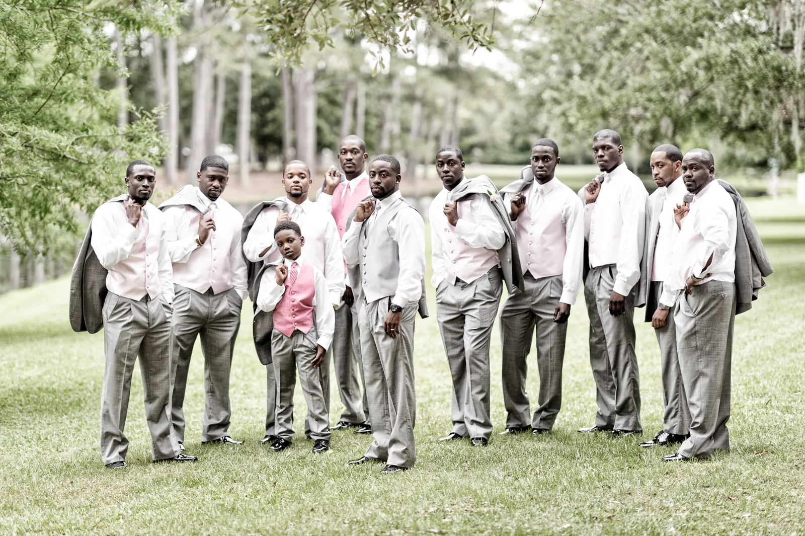 Groomsmen looking cool with jackets over shoulders - Brookgreen Gardens