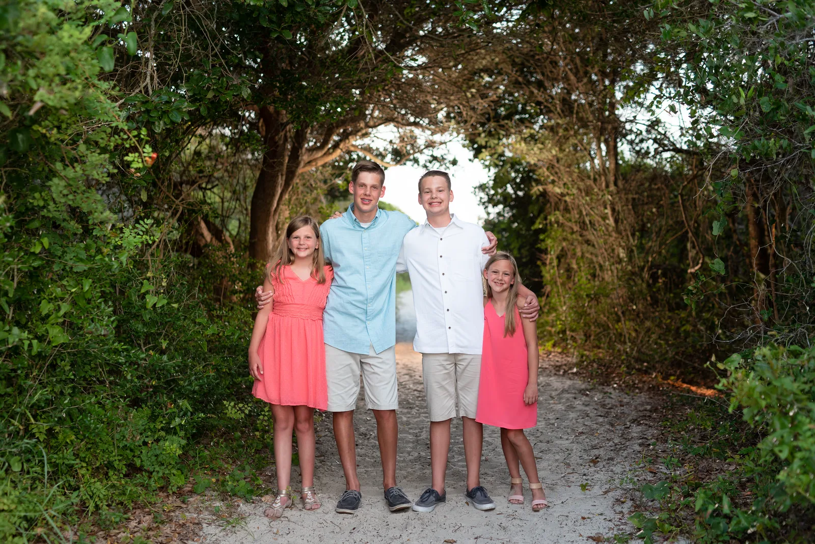 Brothers and sisters standing on the beach path - Huntington Beach State Park