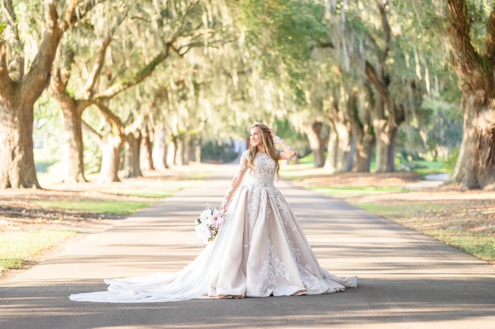 Bride posing under the mossy oaks - Caledonia Golf & Fish Club
