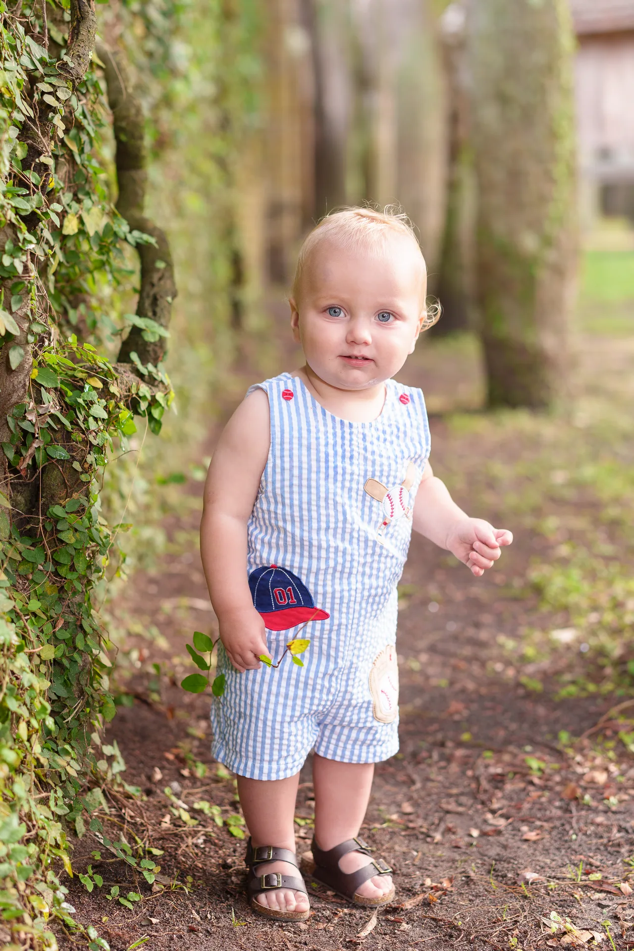 Happy baby boy by the ivy wall - Huntington Beach State Park