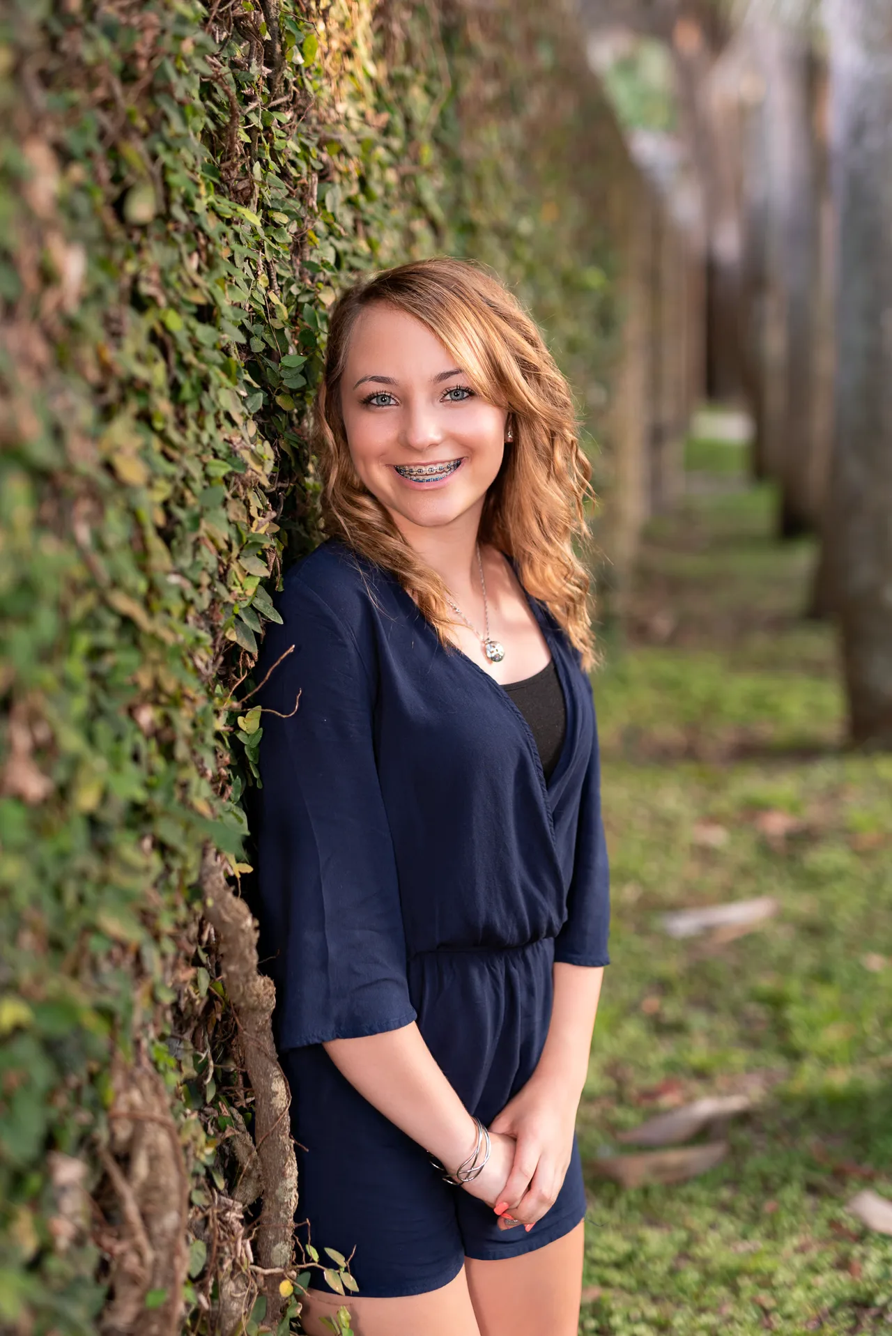 Big smile by the ivy wall -