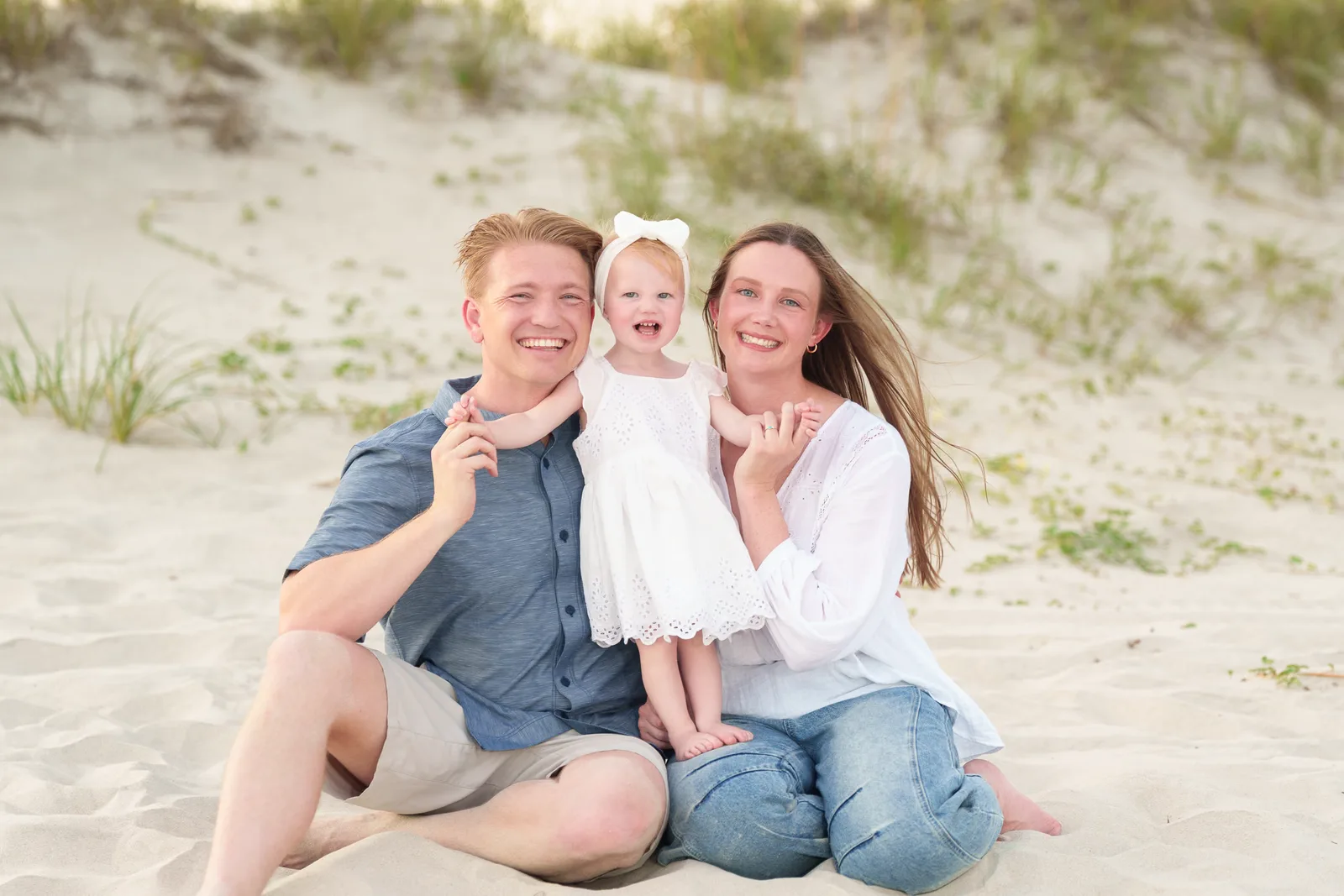 Parents with happy baby daughter - Huntington Beach State Park