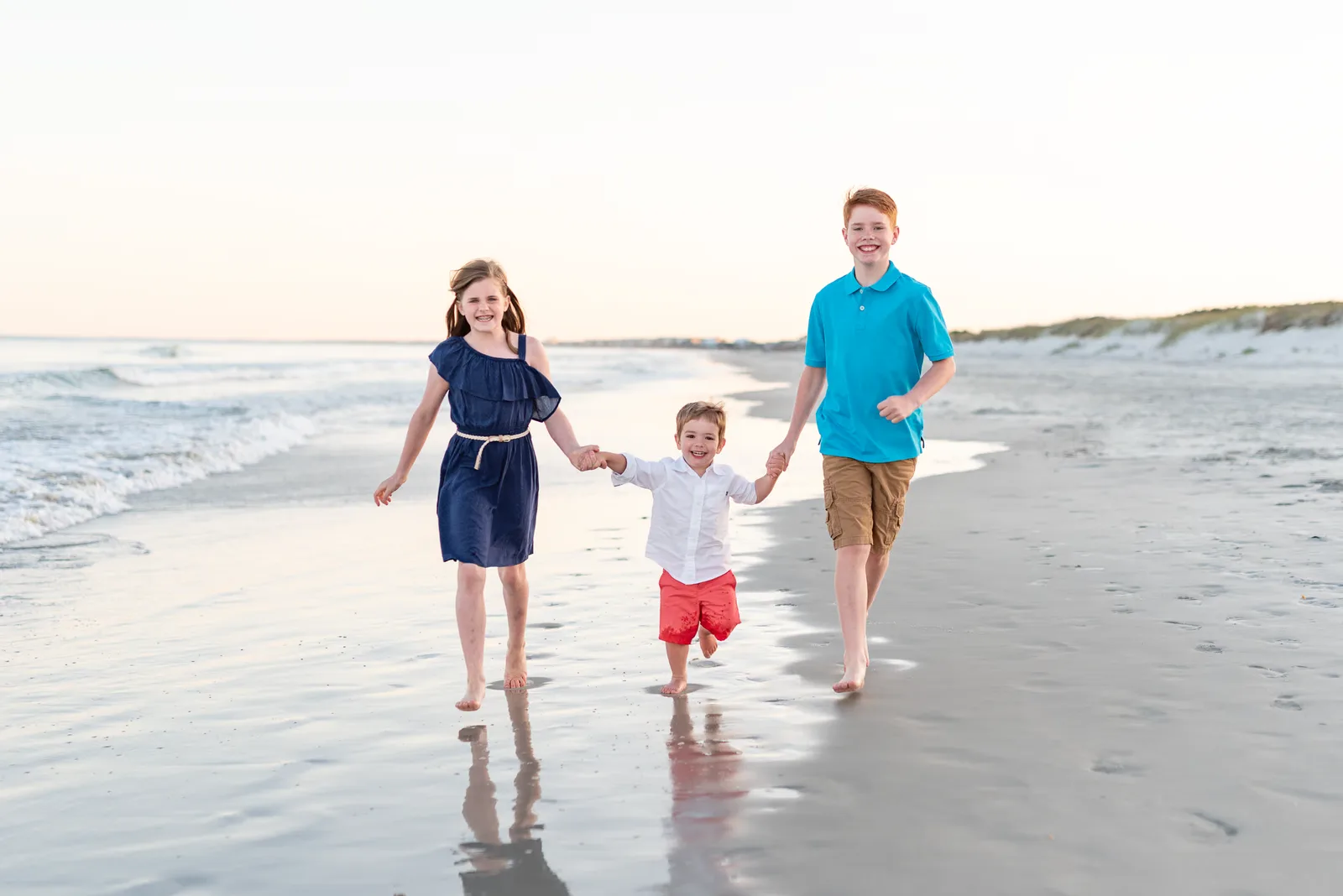 Mom, dad and son walking down the beach - Myrtle Beach