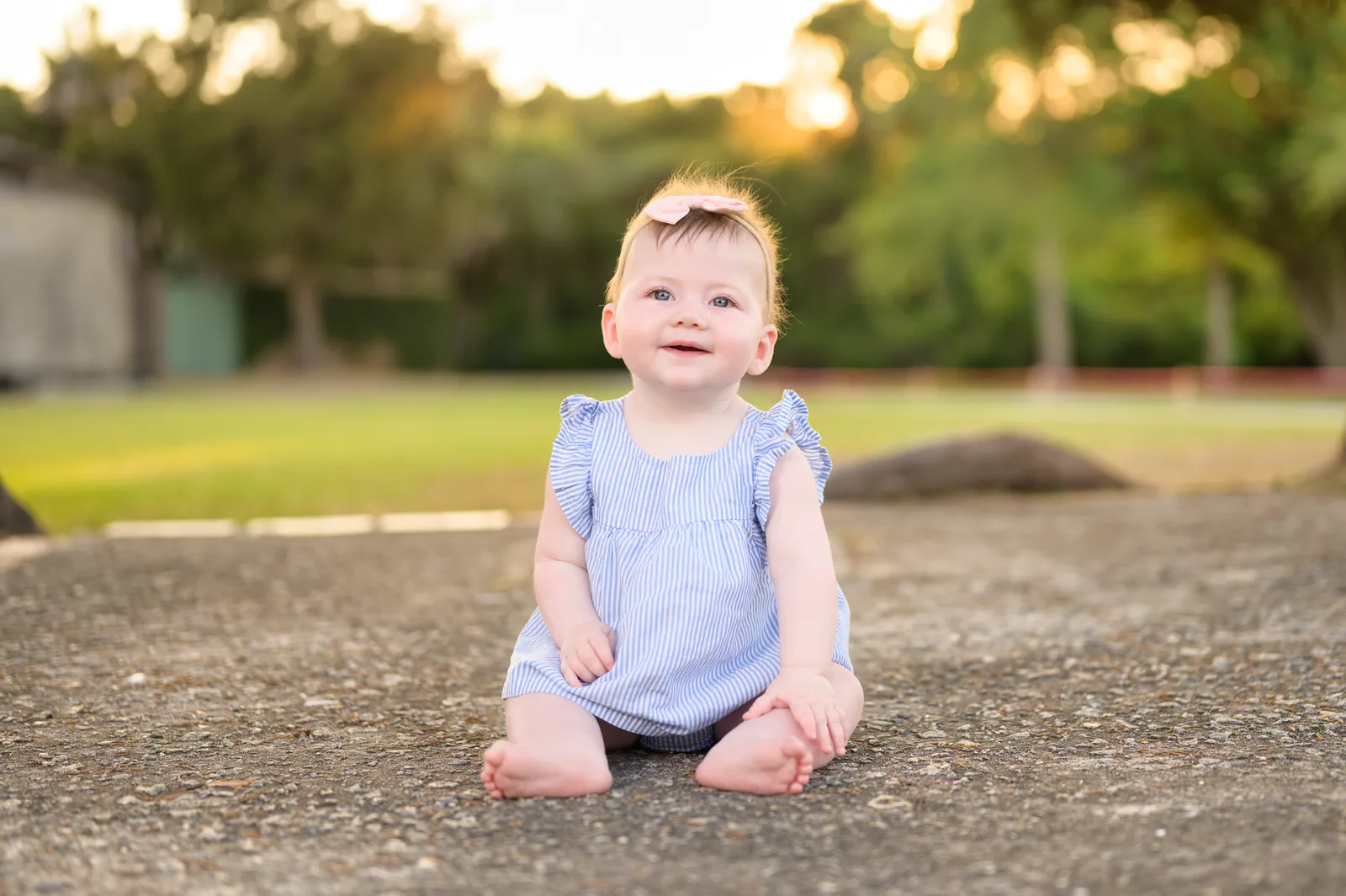 Baby girl sitting in the sunset - Huntington Beach State Park