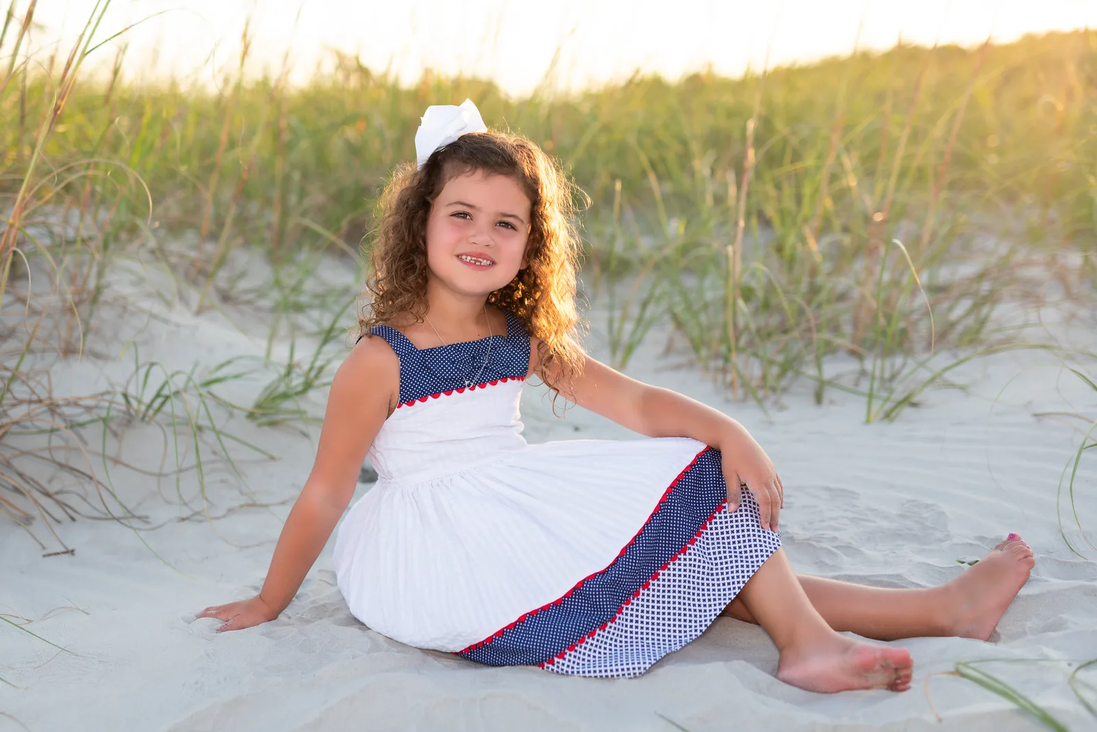 Sitting by the dunes in the sunset - Huntington Beach State Park