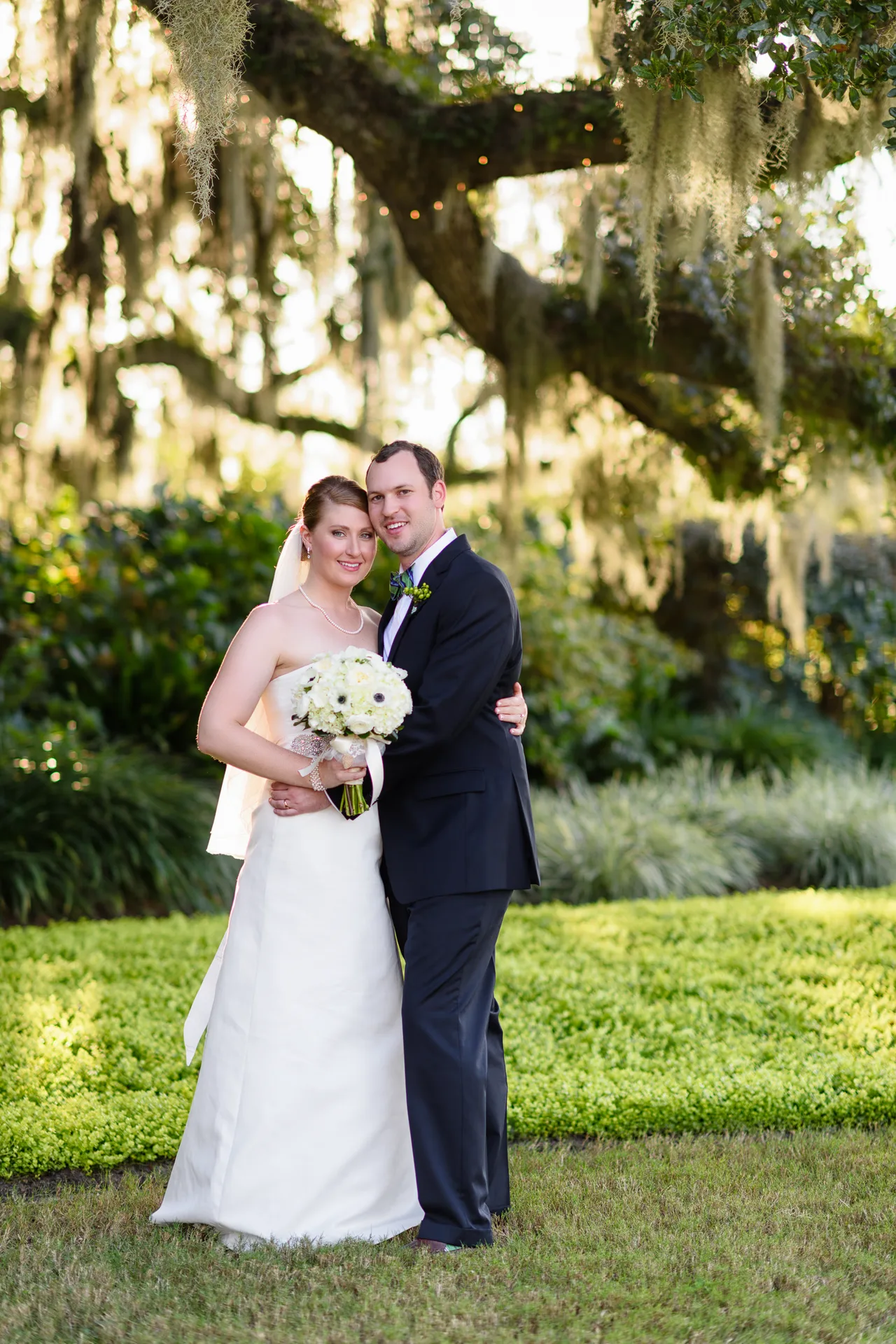 Couple with tree moss and sunset behind them - Heritage Golf Club