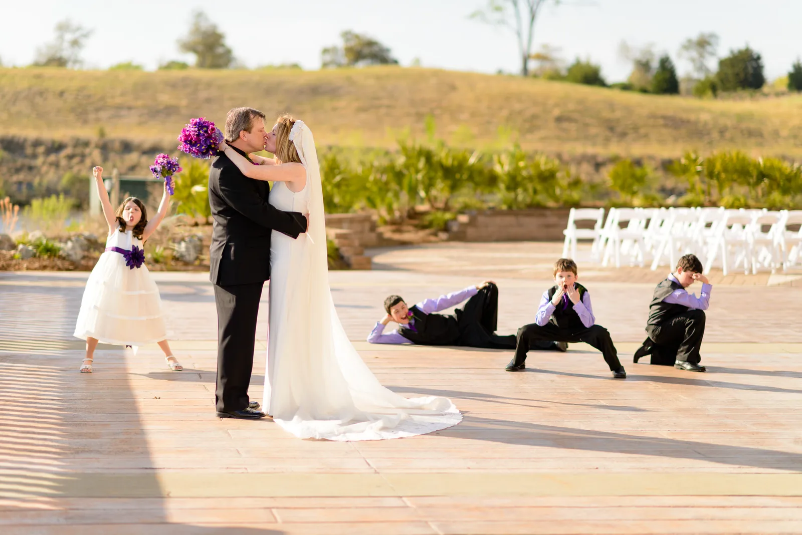 Bride and groom with children having fun in the background - Marina Inn - Myrtle Beach