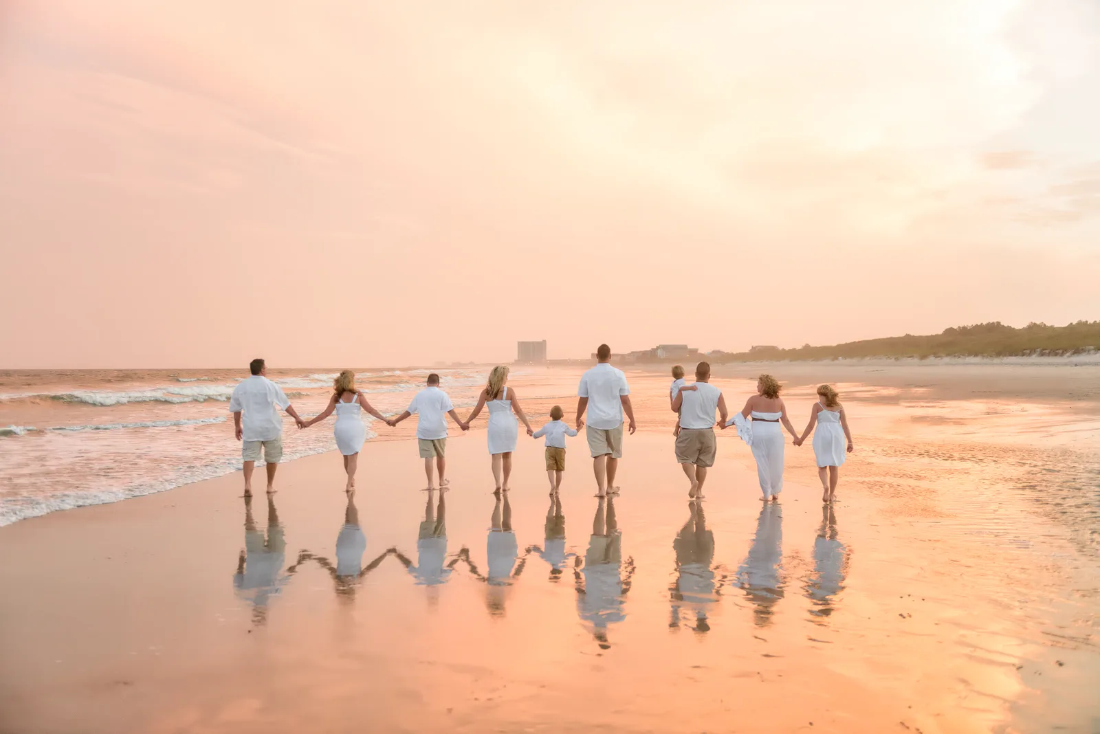 Large family walking down the beach with beautiful color of the sunset - Myrtle Beach