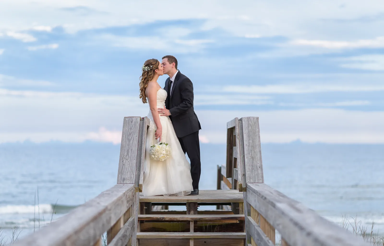 Myrtle Beach sunset wedding portrait with a beautiful sky - North Beach Plantation