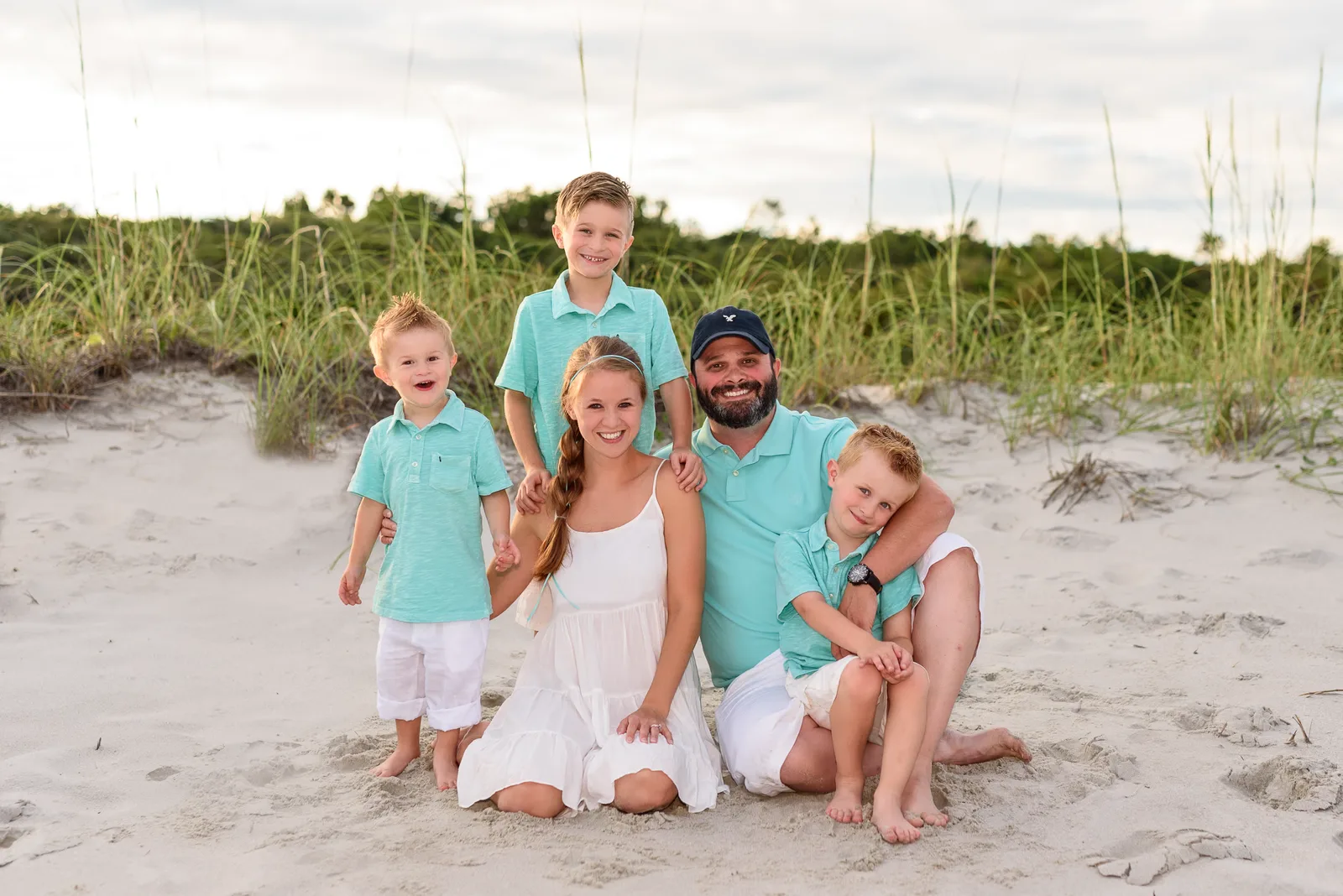 Family sitting by the dunes - Myrtle Beach State Park
