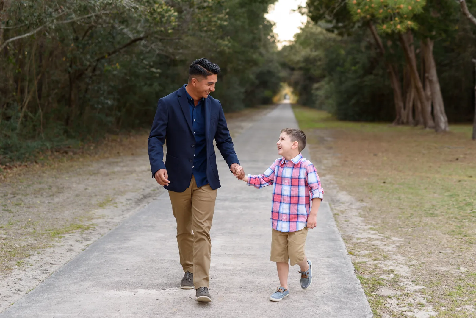 Brothers walking together in front of the Atalaya castle - Huntington Beach State Park