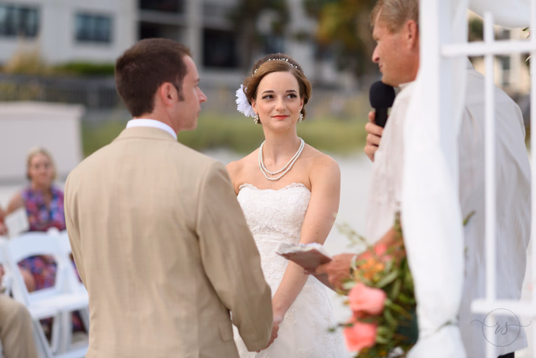 Bride and groom listening to wedding ceremony - Hilton Myrtle Beach Resort at Kingston Resorts
