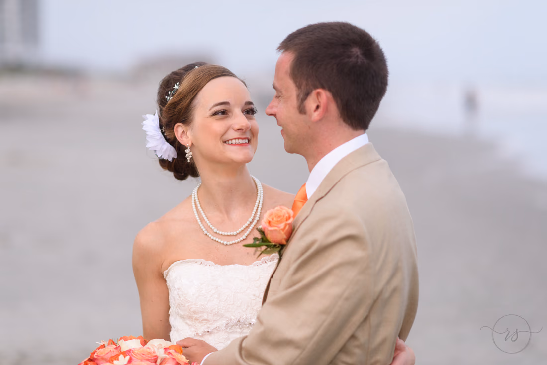 Close-up of the bride smiling up at the groom - Hilton Myrtle Beach Resort at Kingston Resorts