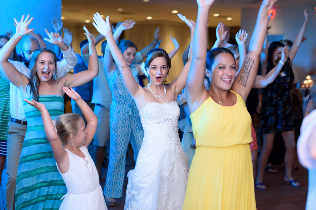 Girls dancing with hands in the air - Hilton Myrtle Beach Resort at Kingston Resorts