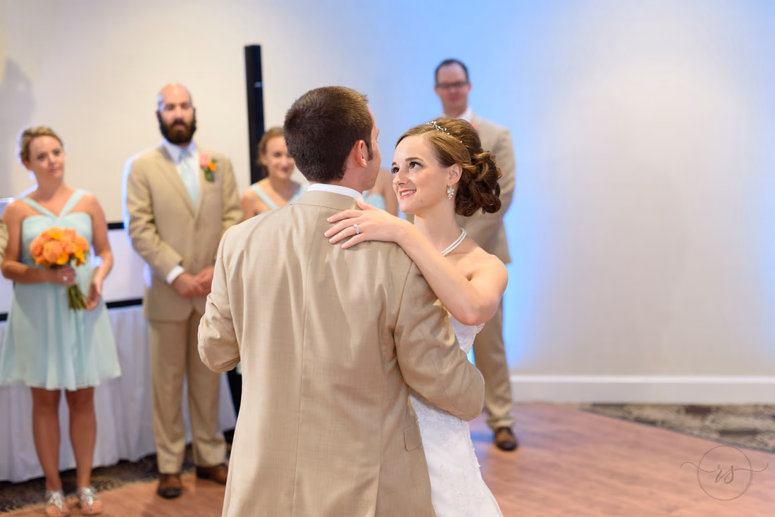 Bride looking up at groom during first dance - Hilton Myrtle Beach Resort at Kingston Resorts