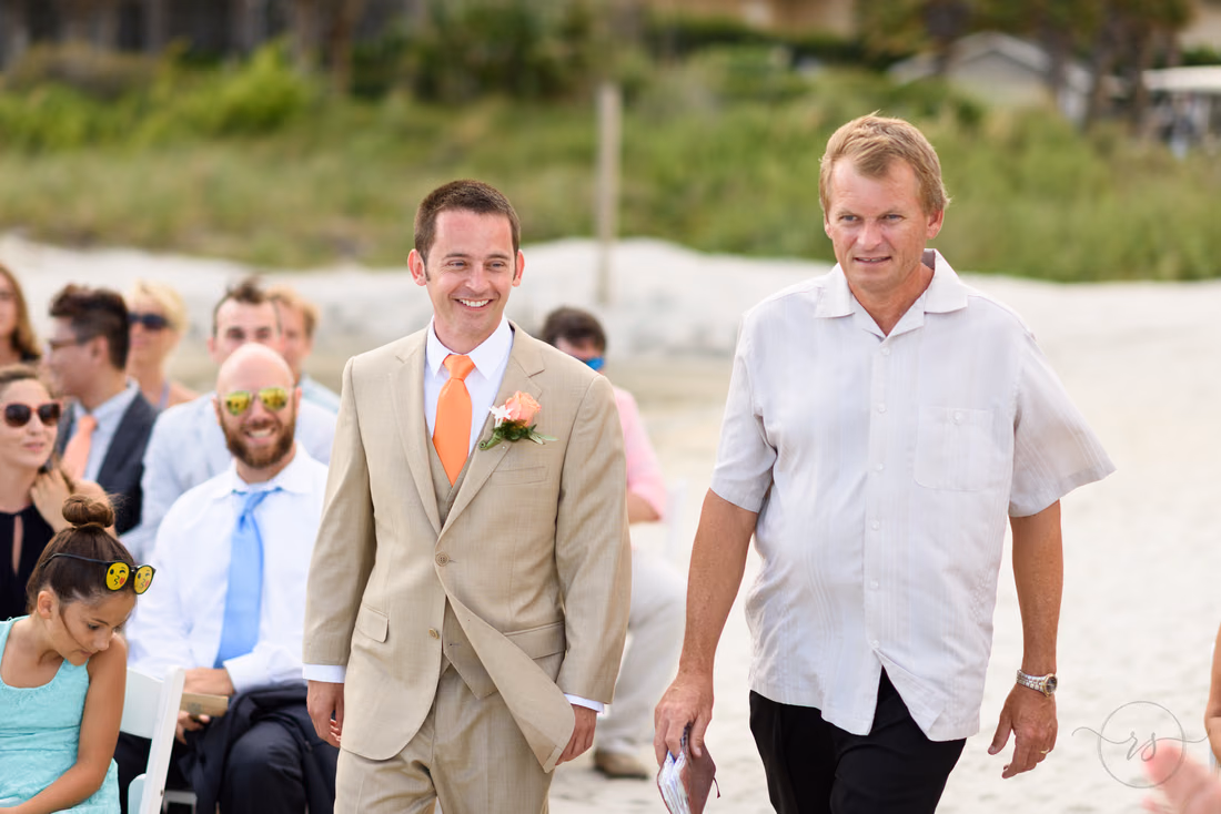 Happy groom walking to ceremony - Hilton Myrtle Beach Resort at Kingston Resorts