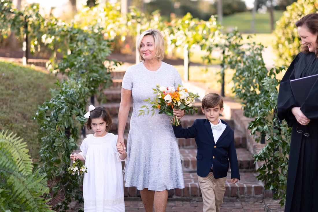 Bride walking into the ceremony with grandchildren - Dunes Golf and Beach Club - Myrtle Beach