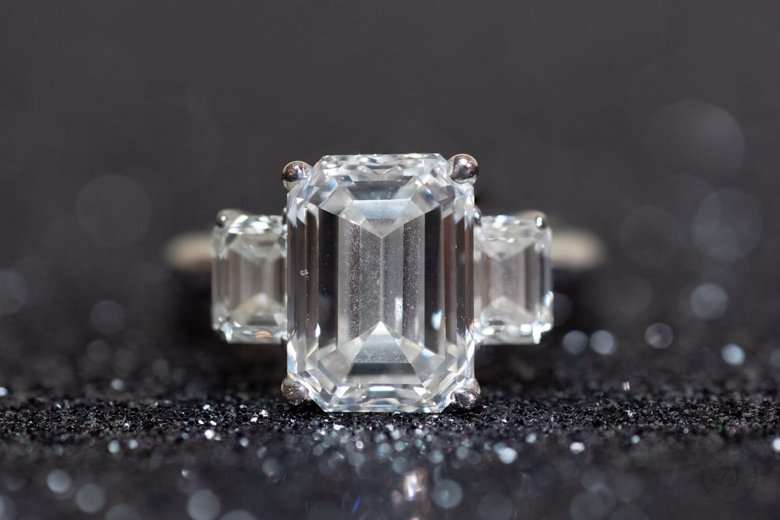 Emerald cut diamond ring on black glitter at the Dunes Golf and Beach Club in Myrtle Beach