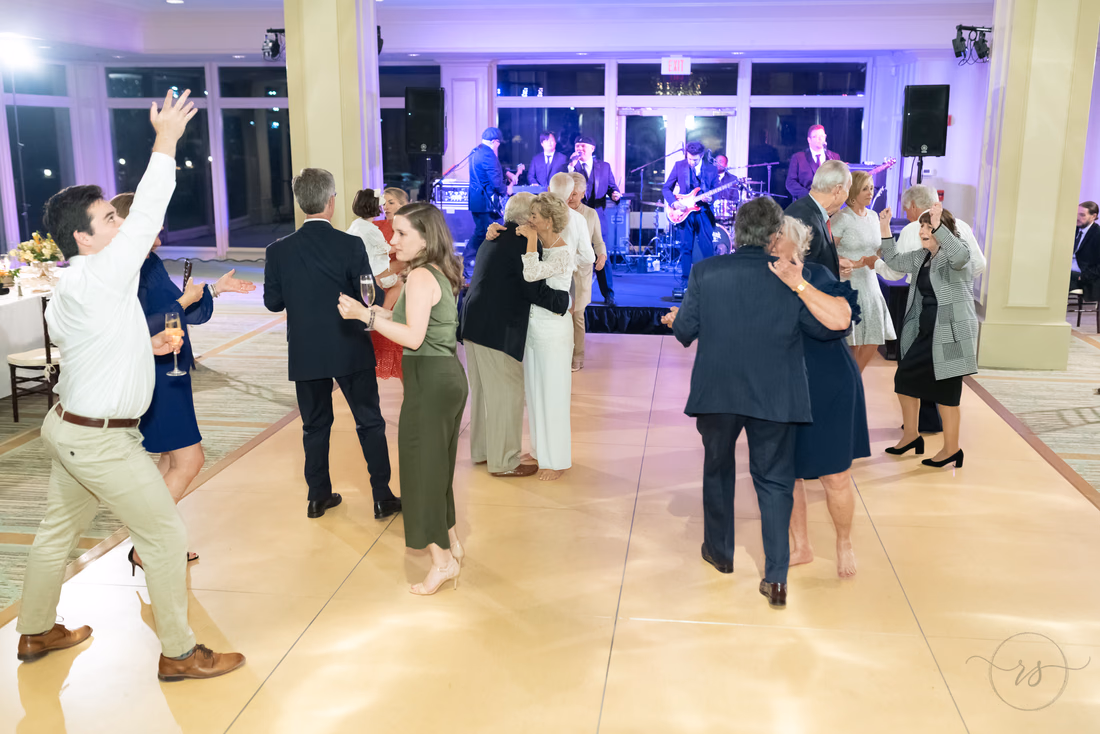 Guests fill the dance floor in front of the band under purple lights at the Dunes Golf and Beach Club in Myrtle Beach