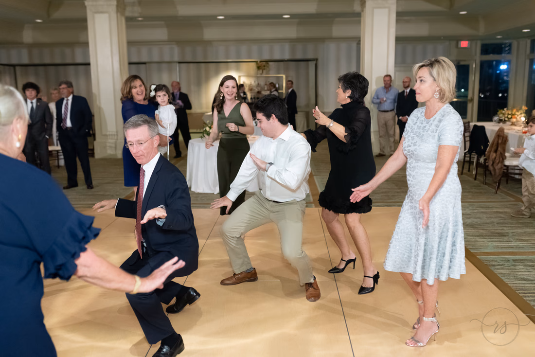 Guests squat low together on the dance floor at the Dunes Golf and Beach Club in Myrtle Beach