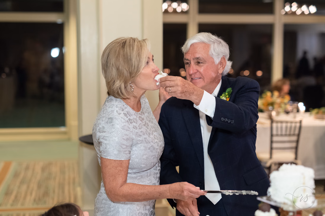 Groom feeding bride the cake - Dunes Golf and Beach Club - Myrtle Beach