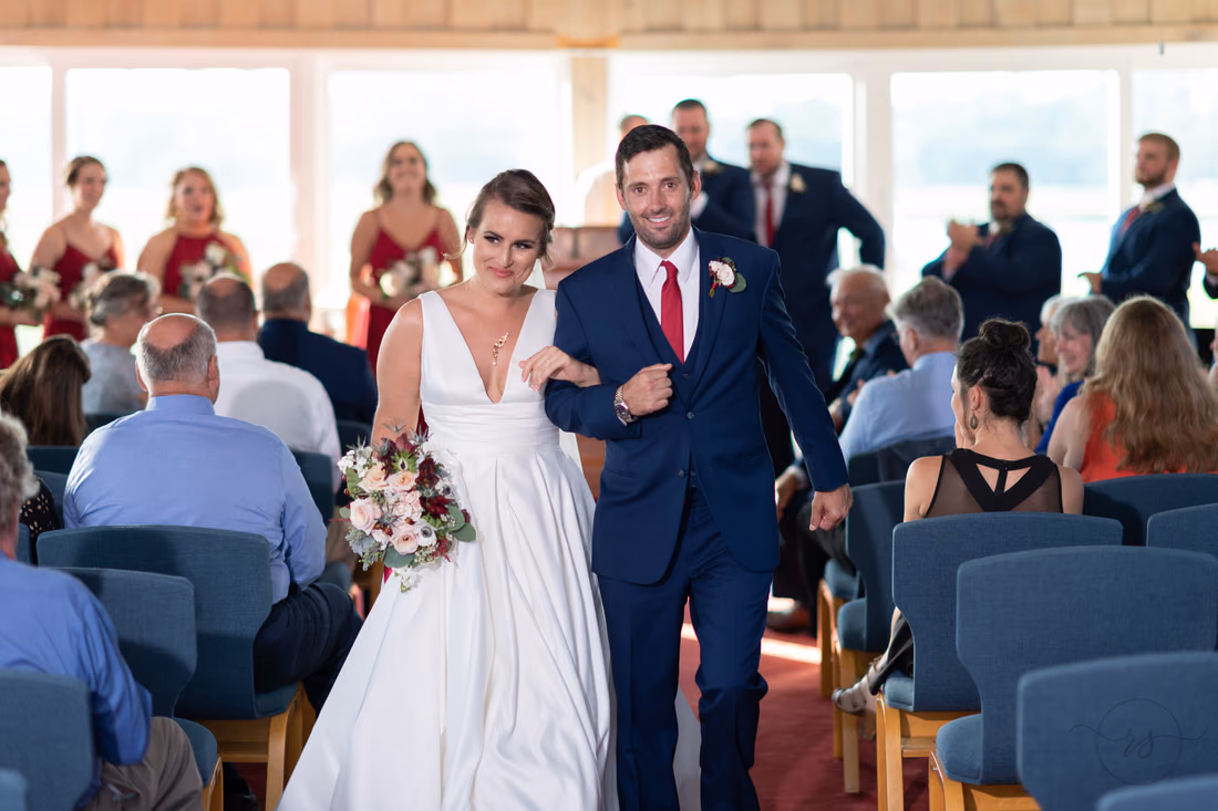 Happy couple walking away from the ceremony - Pawleys Island Chapel