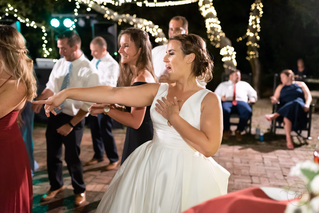 Bride singing and dancing with guests at the reception - Pelican Inn - Pawleys Island