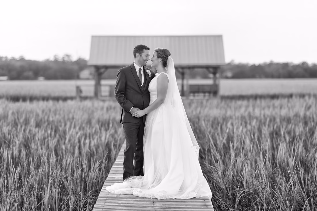 Looking into each other's eyes on the boardwalk in black and white - Pelican Inn - Pawleys Island