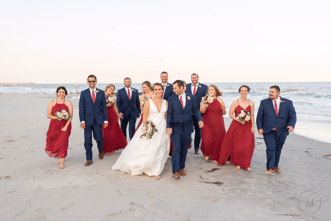 Wedding party walking down the beach - Pelican Inn - Pawleys Island