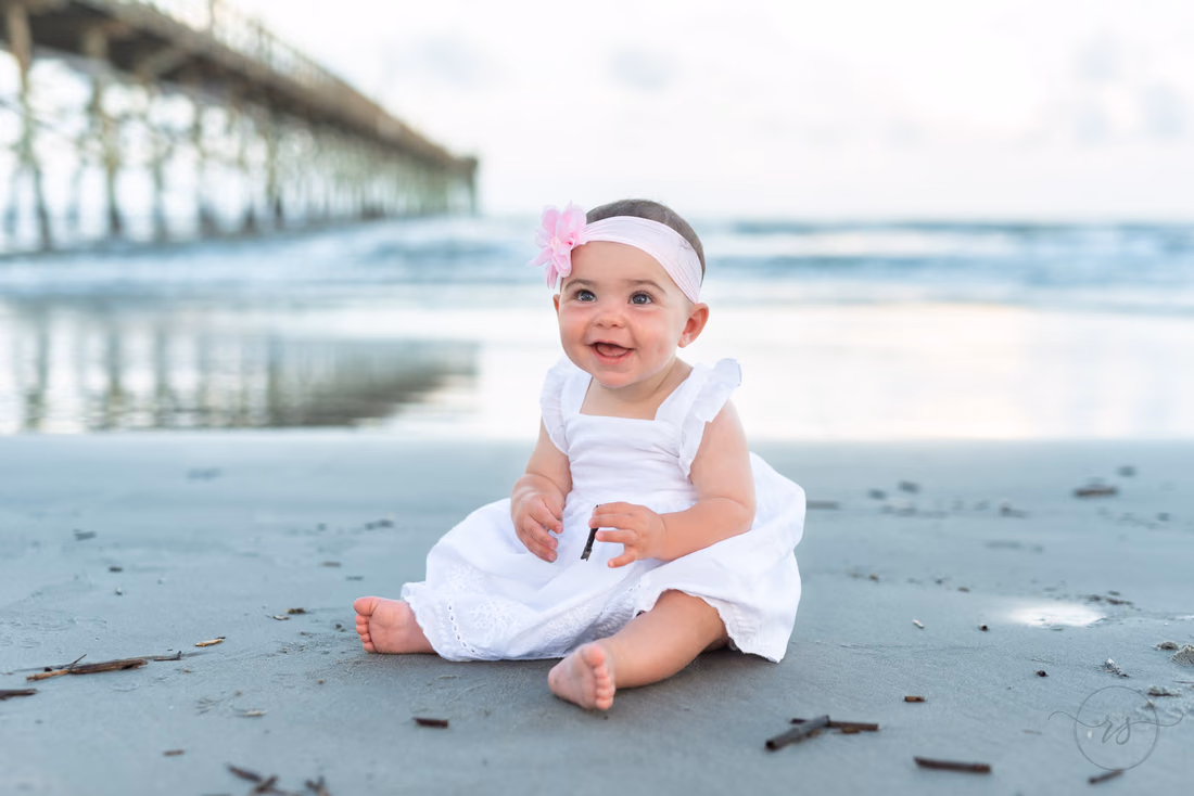 Baby girl sitting by the pier - Ocean Isle