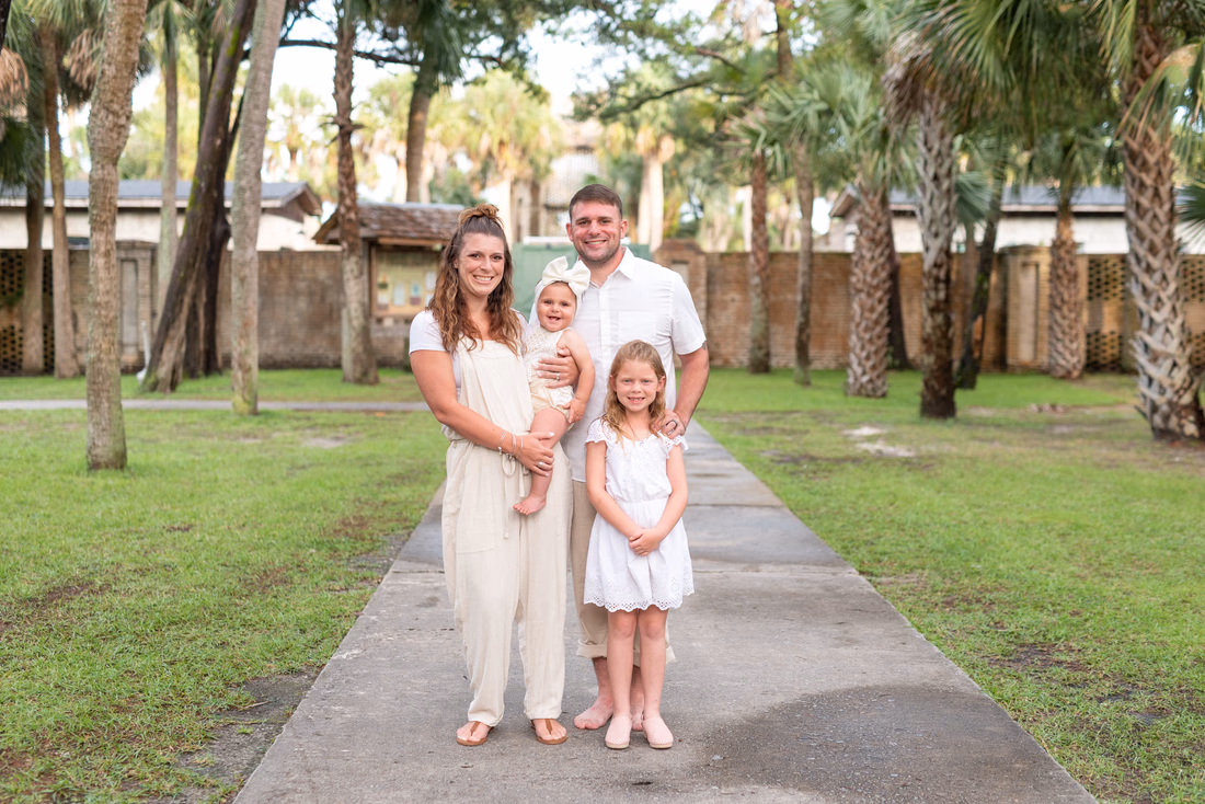 Family standing on the path by Atalaya Castle at Huntington Beach State Park