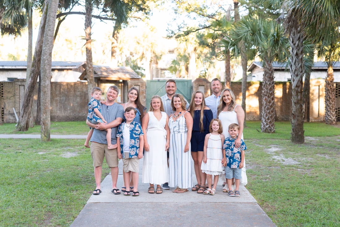 Large family standing on the path by Atalaya Castle at Huntington Beach State Park